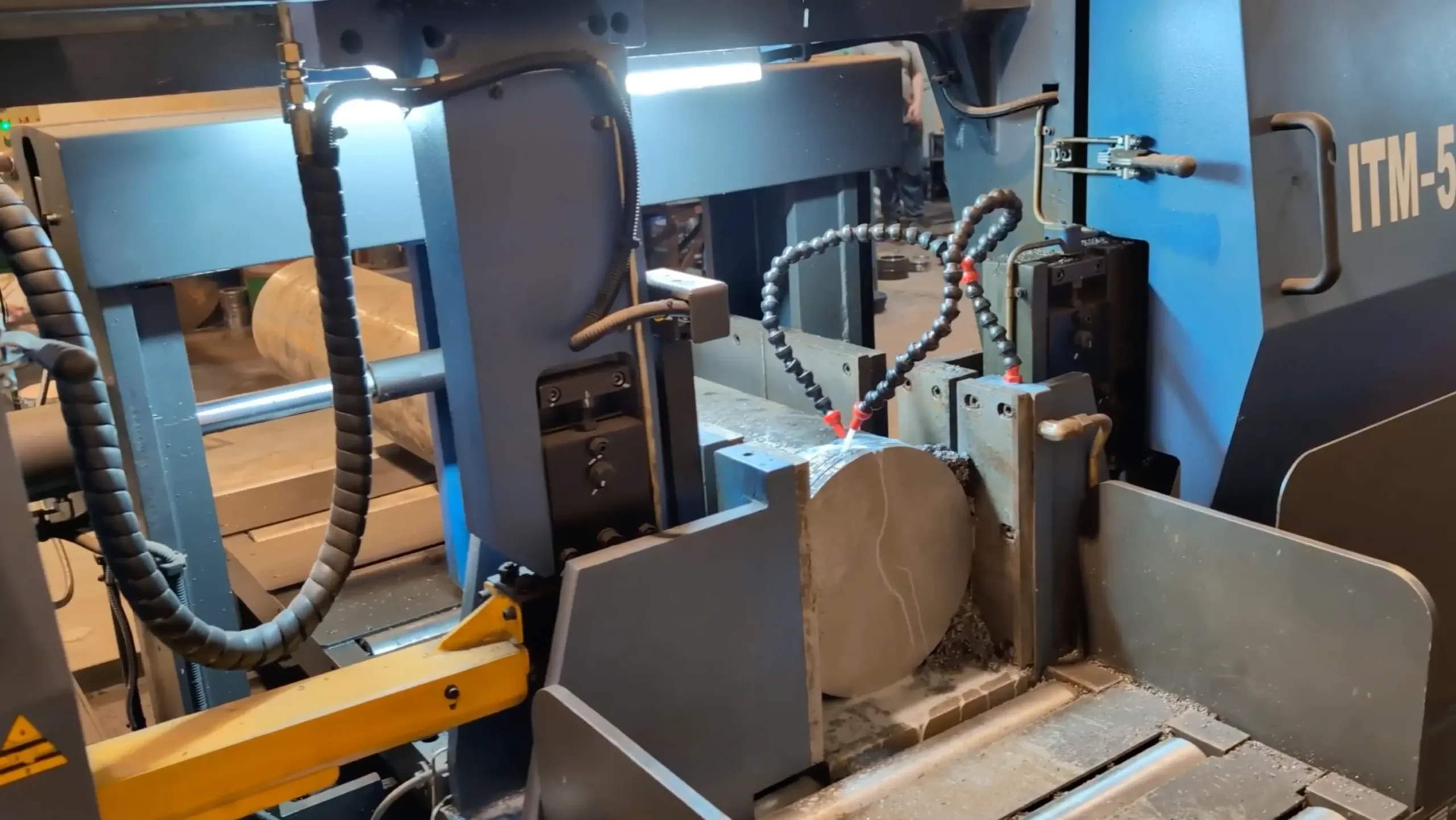 Raw steel material being cut for precision slitter knife manufacturing