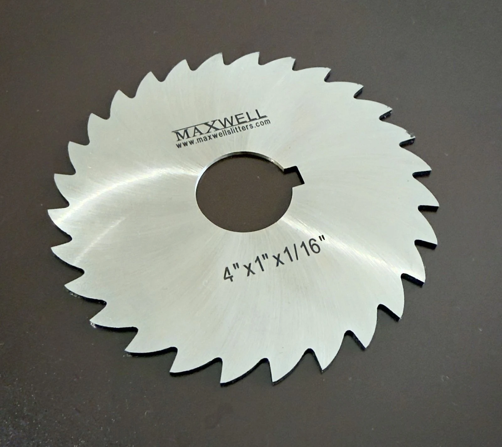 4 inch x 1 inch bore x 1/16 inch HSS metal slitting saw with keyway, laser-marked maxwellslitters.com, made by Maxwell Slitter Industries.